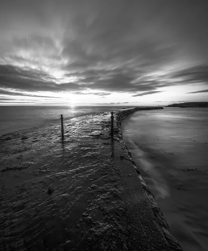 Cullercoats Groin Sunrise, a black and white photograph from the North East