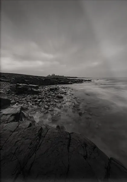 Dunstanburgh Castle Mood, a black and white photograph from the North East