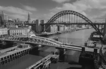 Swing and Tyne Bridge, a black and white photograph from the North East